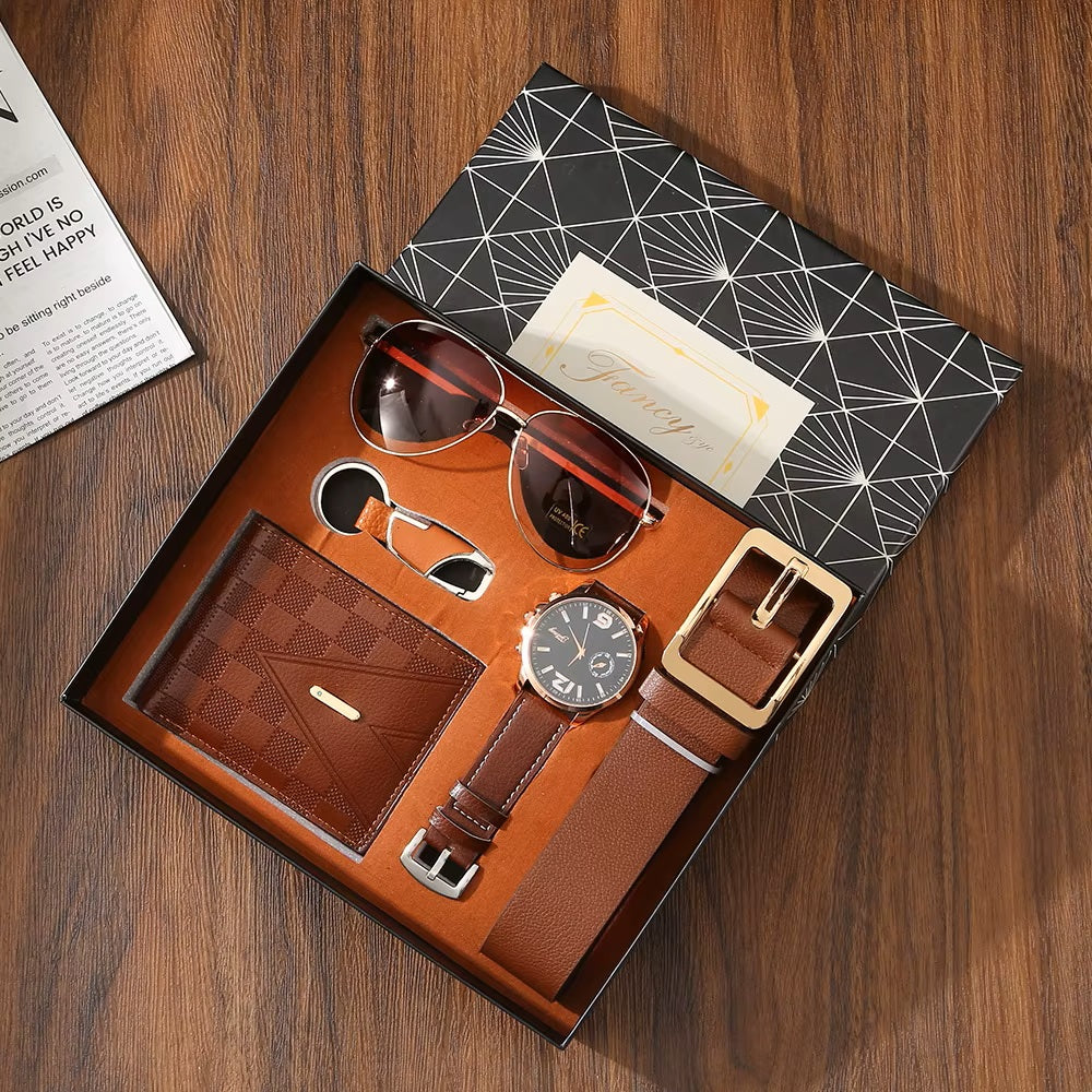 Men's accessories set including wallet, watch, belt, and sunglasses in a box on a wooden surface.